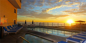 sunset over pool at Pismo Beach Lighthouse suites